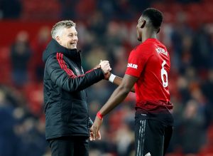 Manchester United's Paul Pogba and interim manager Ole Gunnar Solskjaer.