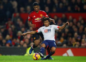 Bournemouth's Nathan Ake in action with Manchester United's Marcus Rashford.