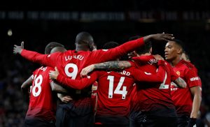 Manchester United's Romelu Lukaku celebrates scoring their fourth goal with team mates.