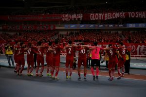 SIPG's players celebrate victory after match.