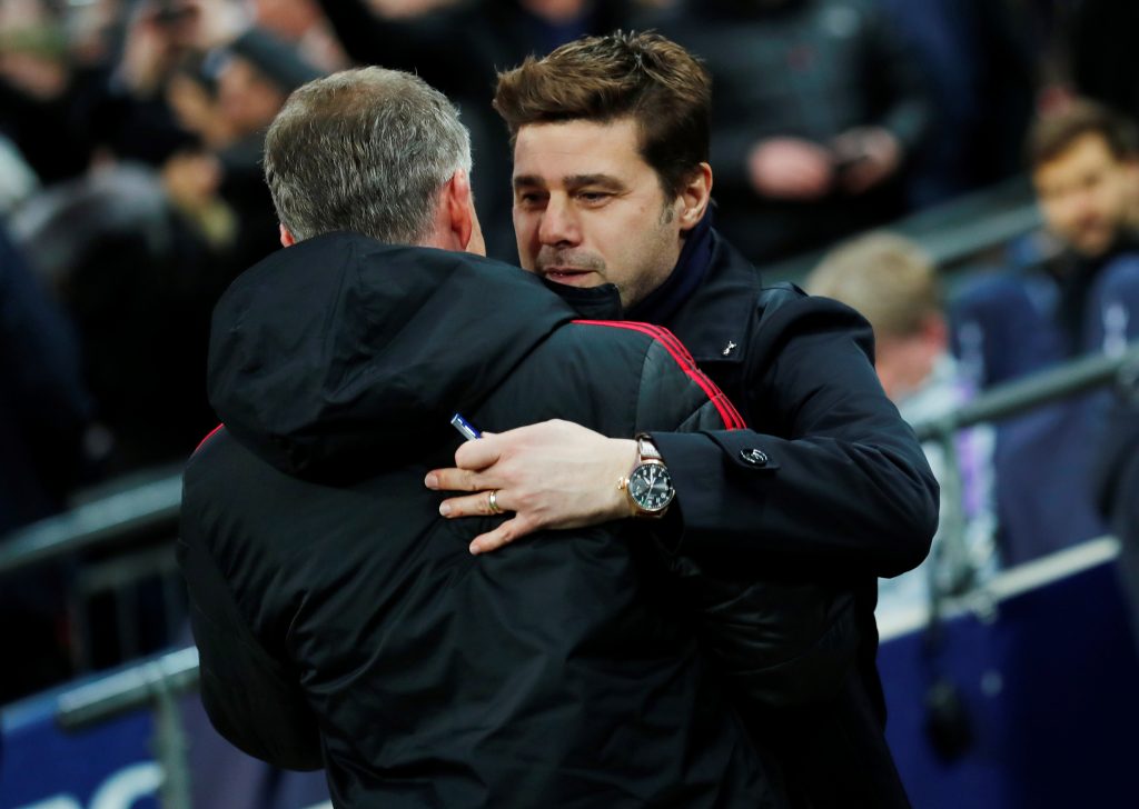 Mauricio Pochettino embraces MUFC interim manager Ole Gunnar Solskjaer before the match.