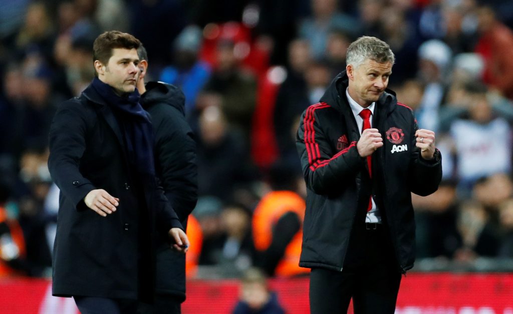 Ole Gunnar Solskjaer reacts at the end of the match as Mauricio Pochettino looks on.