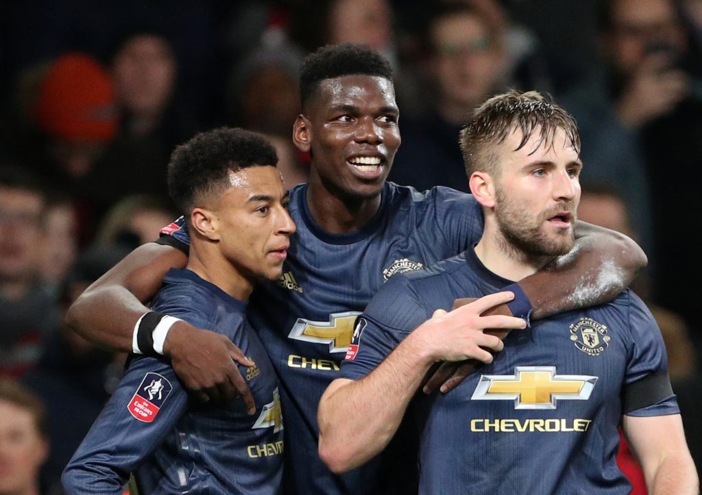 Manchester United's Jesse Lingard celebrates scoring their second goal with Paul Pogba and Luke Shaw.