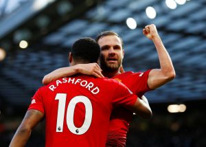 Manchester United's Juan Mata celebrates scoring their second goal with Marcus Rashford.
