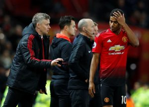 Ole Gunnar Solskjaer gives instructions to Marcus Rashford.