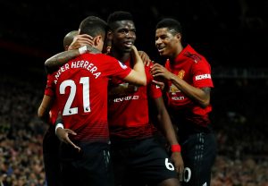 Manchester United's Paul Pogba celebrates with Ander Herrera and Marcus Rashford after scoring their second goal.