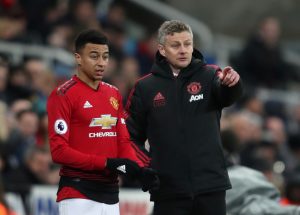 Jesse Lingard receives instructions from Ole Gunnar Solskjaer before being substituted on.