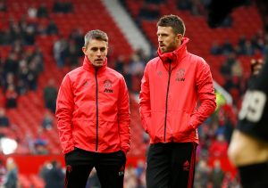 Manchester United assistant coaches Kieran McKenna and Michael Carrick during the warm up before the match.