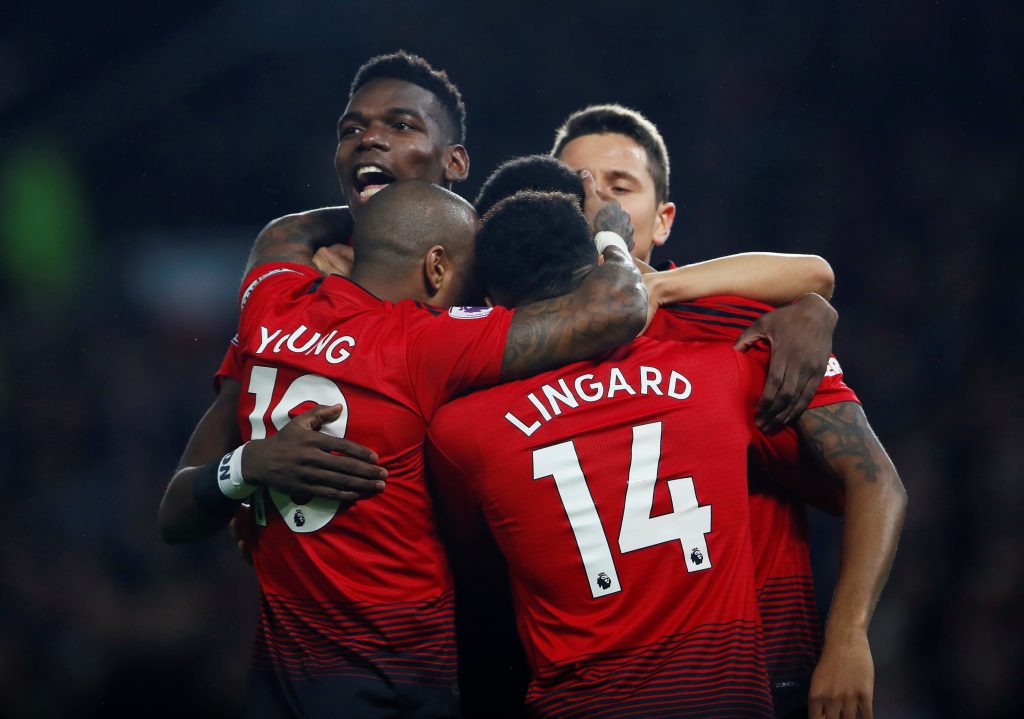 Manchester United's Paul Pogba celebrates with team mates after scoring their first goal.