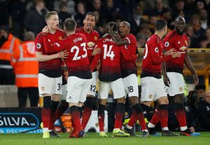 Man Utd's Scott McTominay celebrates scoring their first goal with team mates.