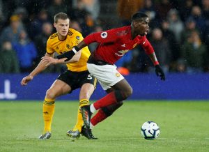 Wolves' Ryan Bennett in action with Manchester United's Paul Pogba.