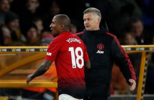 Man Utd's Ashley Young with manager Ole Gunnar Solskjaer after being sent off.