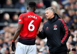 Paul Pogba receives instructions from Ole Gunnar Solskjaer.