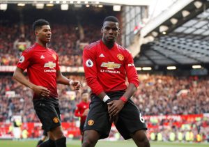 Manchester United's Paul Pogba celebrates scoring their second goal with Marcus Rashford.