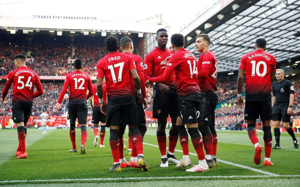 Manchester United's Paul Pogba celebrates scoring their second goal with team mates.
