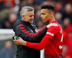 Ole Gunnar Solskjaer and Manchester United's Mason Greenwood celebrate.