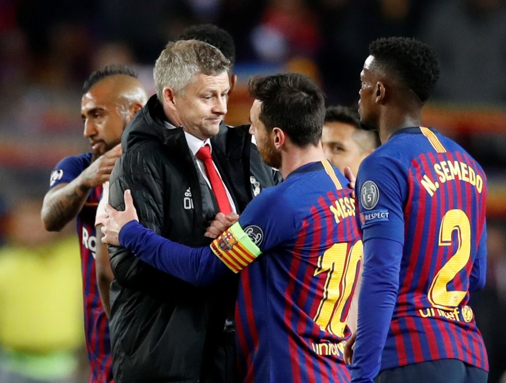 Man Utd manager Ole Gunnar Solskjaer with Barcelona's Lionel Messi.