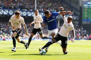 Everton's Dominic Calvert-Lewin in action with Manchester United's Ashley Young.