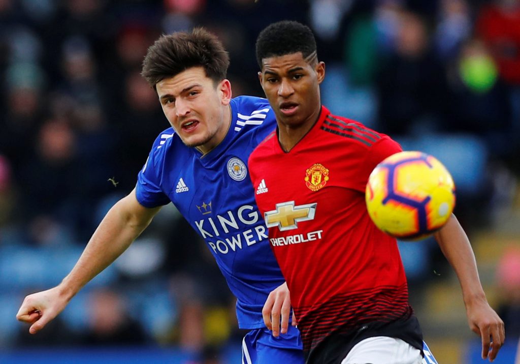 Manchester United's Marcus Rashford in action with Leicester City's Harry Maguire.