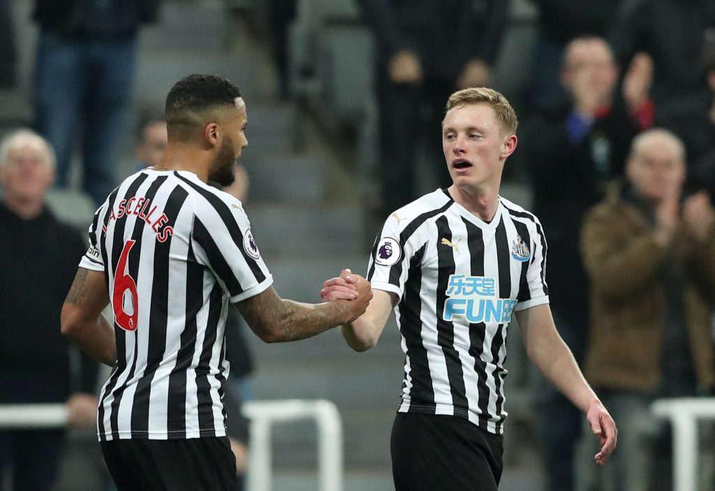 Newcastle's Sean Longstaff celebrates scoring their second goal with Jamaal Lascelles.