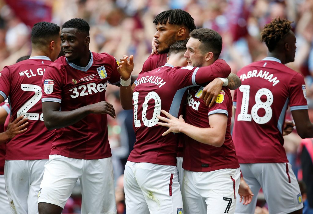 Aston Villa's John McGinn celebrates scoring their second goal with Jack Grealish and team mates.