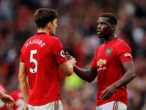 Manchester United's Harry Maguire and Paul Pogba celebrate at the end of the match.