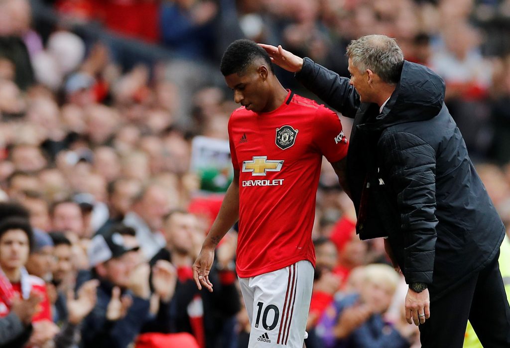 Manchester United's Marcus Rashford is congratulated by manager Ole Gunnar Solskjaer as he is substituted.