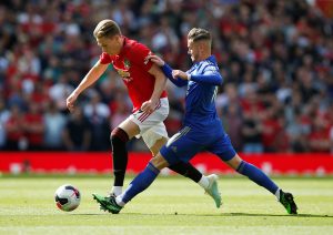 Manchester United's Scott McTominay in action with Leicester City's James Maddison.