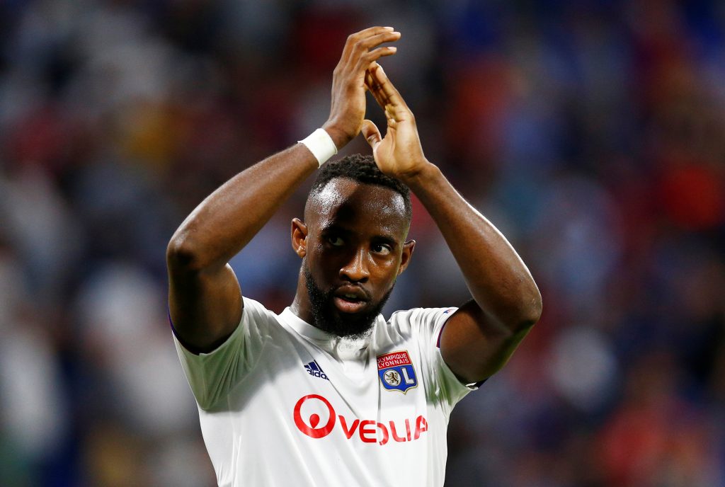 Lyon's Moussa Dembele applauds fans after the match.
