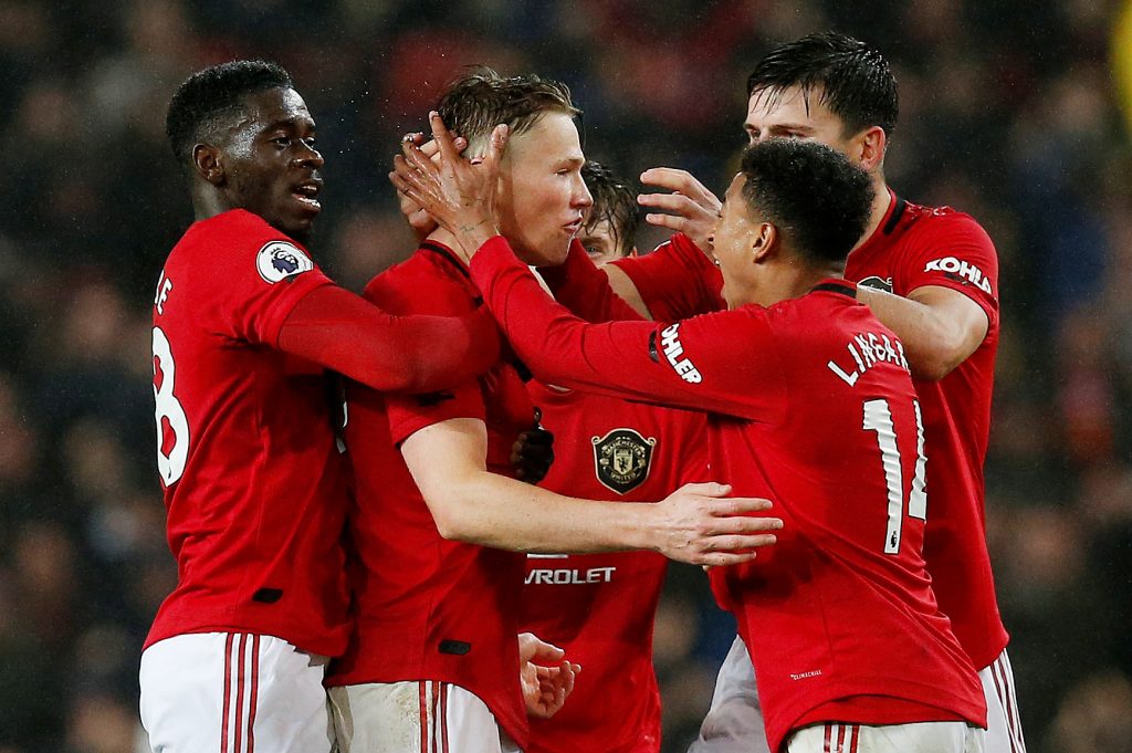 Manchester United's Scott McTominay celebrates scoring their first goal with team mates.