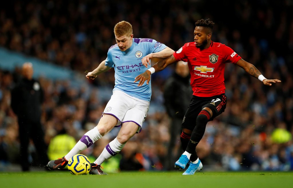 Man City's Kevin De Bruyne in action with Man Utd's Fred.
