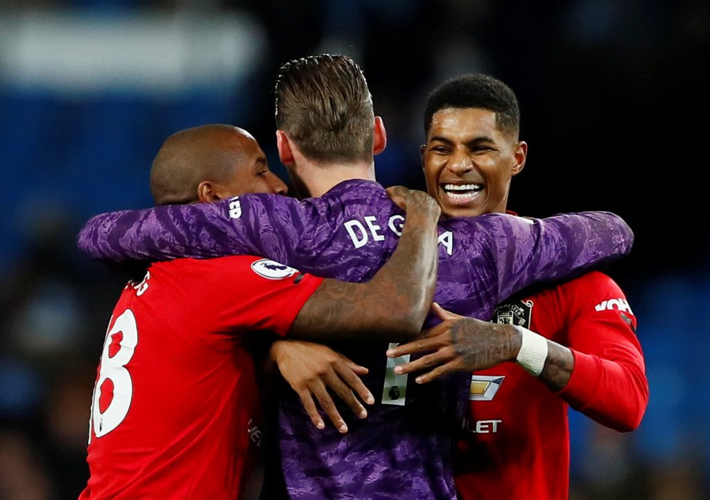 Marcus Rashford, Ashley Young and David de Gea celebrate after the match.