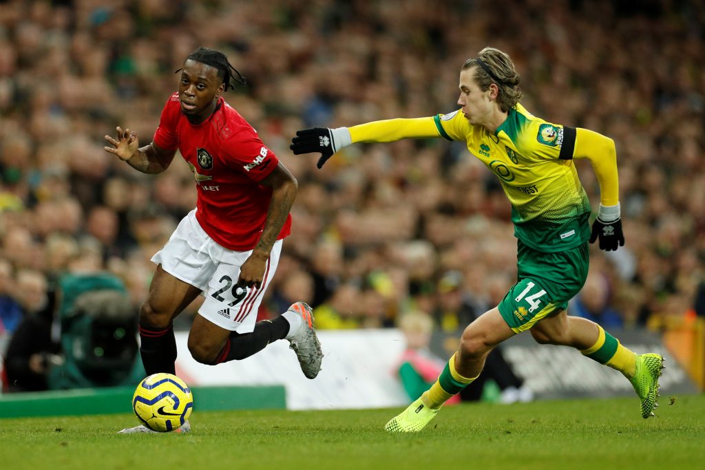 Manchester United's Aaron Wan-Bissaka in action with Norwich City's Todd Cantwell.