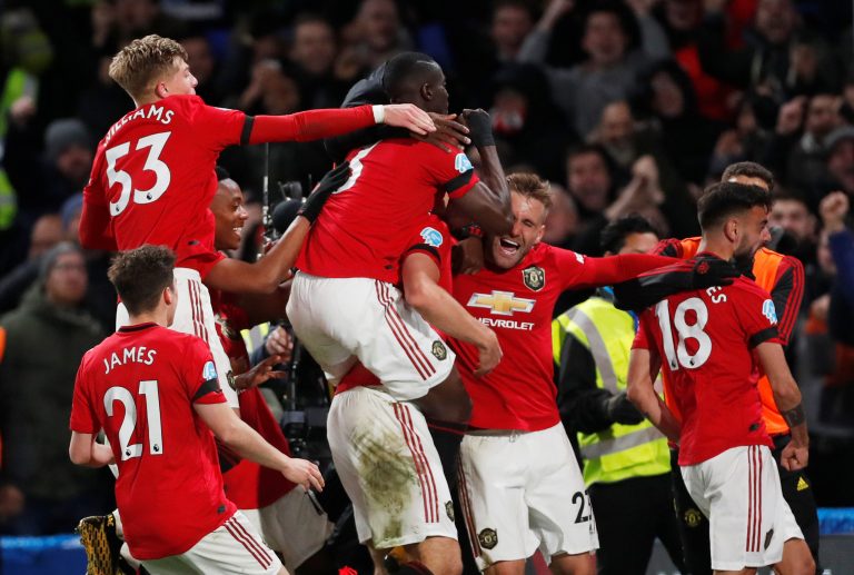 Manchester United's Harry Maguire celebrates scoring their second goal with Luke Shaw, Bruno Fernandes and teammates.