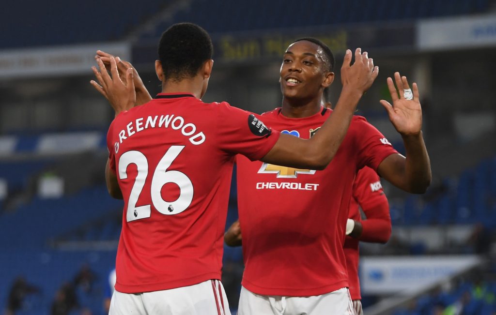 Manchester United's Mason Greenwood celebrates scoring their first goal with Anthony Martial.