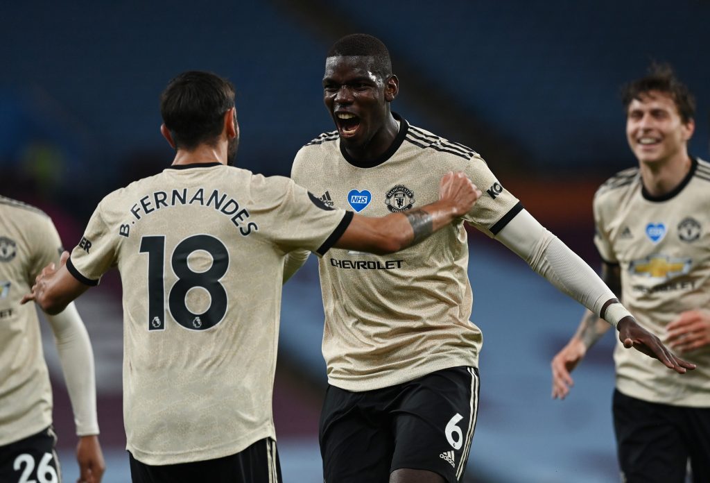 Manchester United's Paul Pogba celebrates scoring their third goal with Bruno Fernandes.