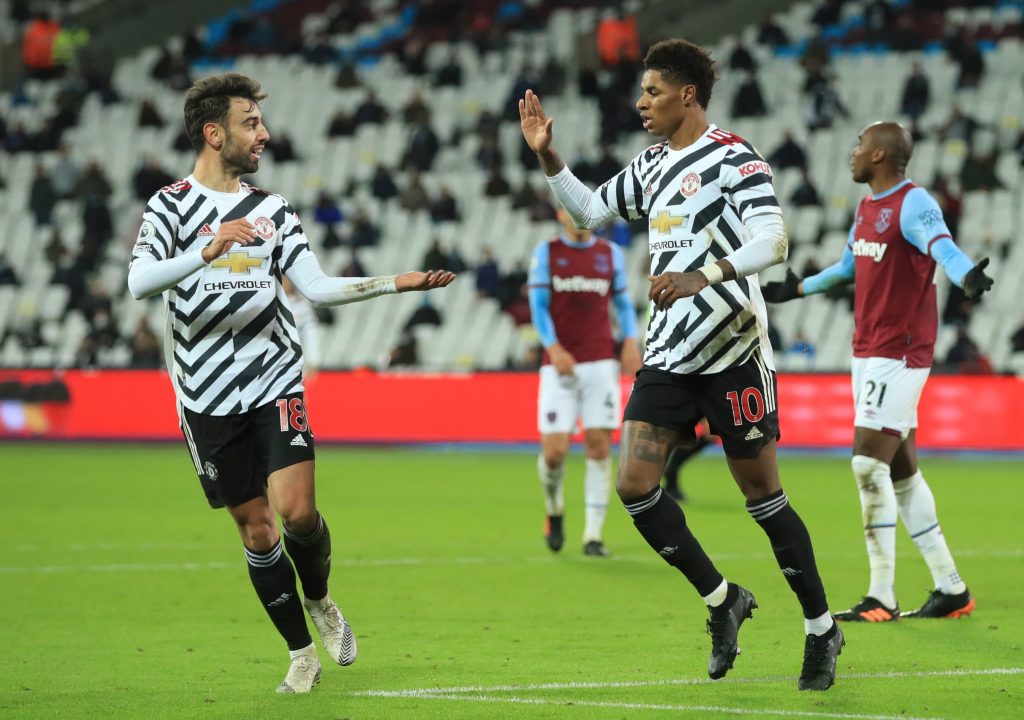 Manchester United's Marcus Rashford celebrates scoring their third goal with Bruno Fernandes.