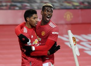 Manchester United's Marcus Rashford celebrates scoring their first goal with Paul Pogba.