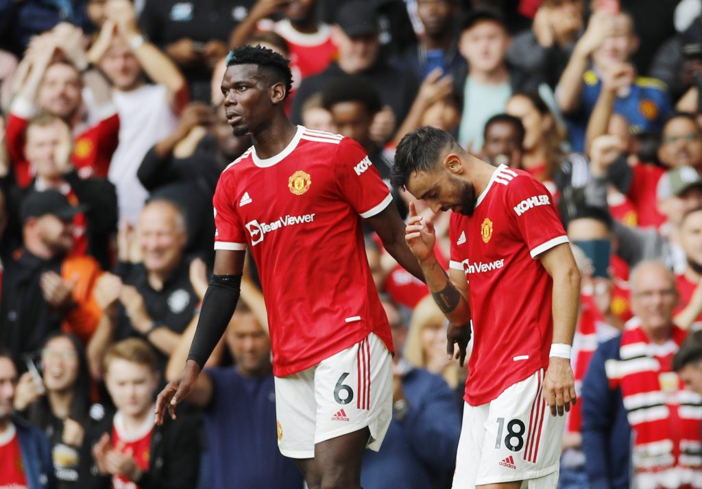 Manchester United's Bruno Fernandes celebrates scoring their first goal with Paul Pogba.