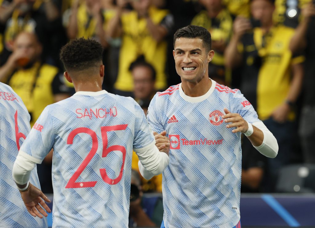 Manchester United's Cristiano Ronaldo celebrates scoring their first goal with Jadon Sancho.