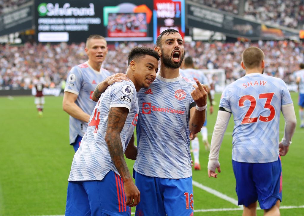 Manchester United's Jesse Lingard celebrates scoring their second goal with Bruno Fernandes against West Ham.