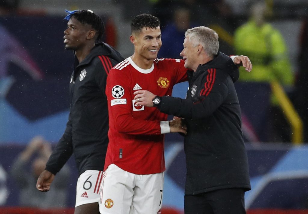 Manchester United's Cristiano Ronaldo celebrates after the match with manager Ole Gunnar Solskjaer.