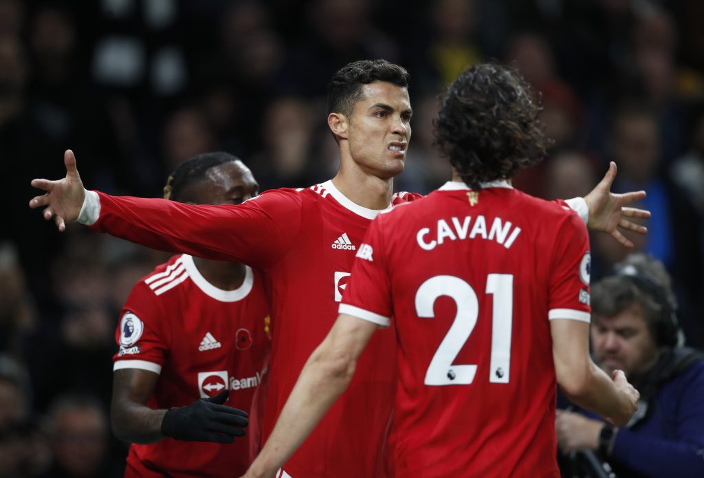 Manchester United's Cristiano Ronaldo celebrates scoring their first goal with Edinson Cavani.