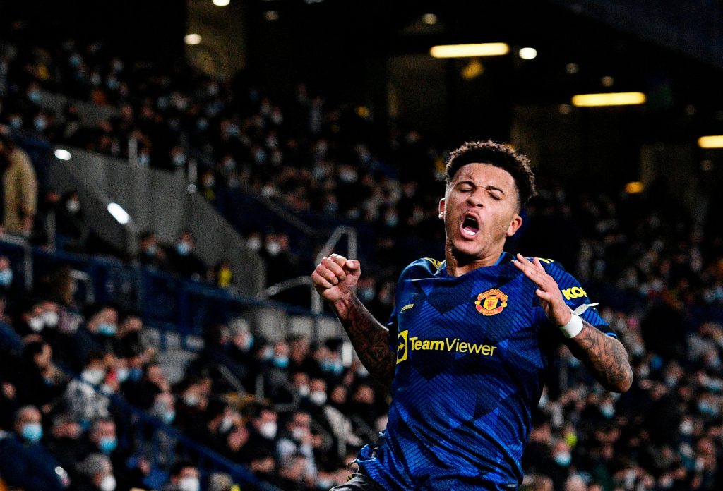Manchester United's Jadon Sancho celebrates scoring their second goal.