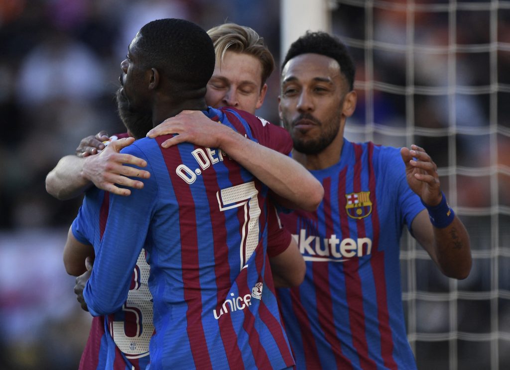Barcelona's Frenkie de Jong celebrates scoring their second goal with Ousmane Dembele, Pierre-Emerick Aubameyang and teammates.