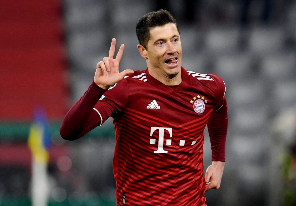 Bayern Munich's Robert Lewandowski celebrates scoring their third goal to complete his hat-trick.