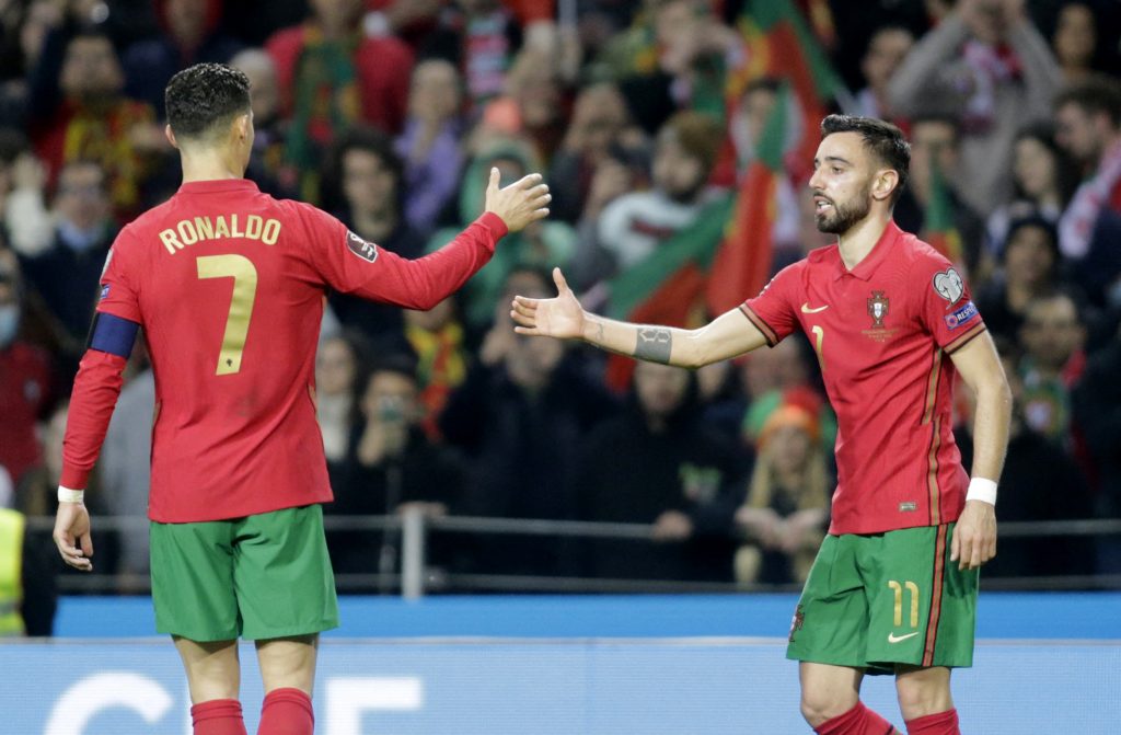 Portugal's Bruno Fernandes celebrates scoring their second goal with Cristiano Ronaldo.