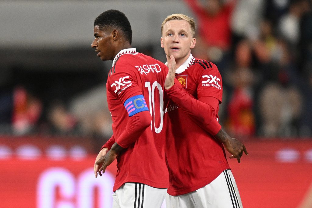 Manchester United's Marcus Rashford celebrates scoring their third goal with teammate Donny van de Beek.