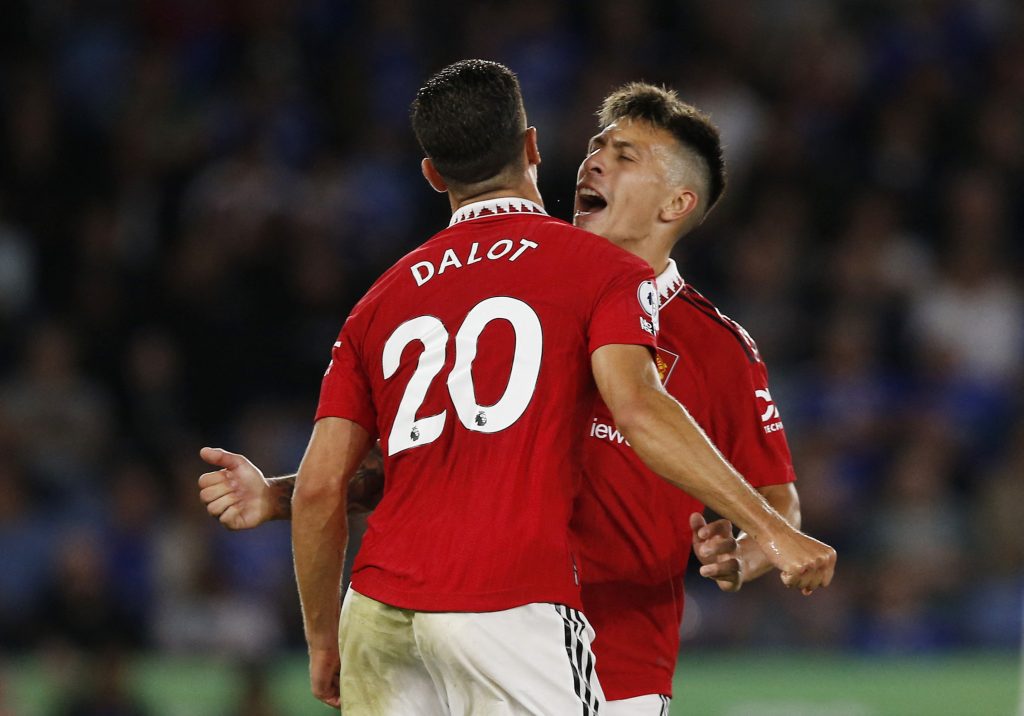 Manchester United's Diogo Dalot and Lisandro Martinez react.