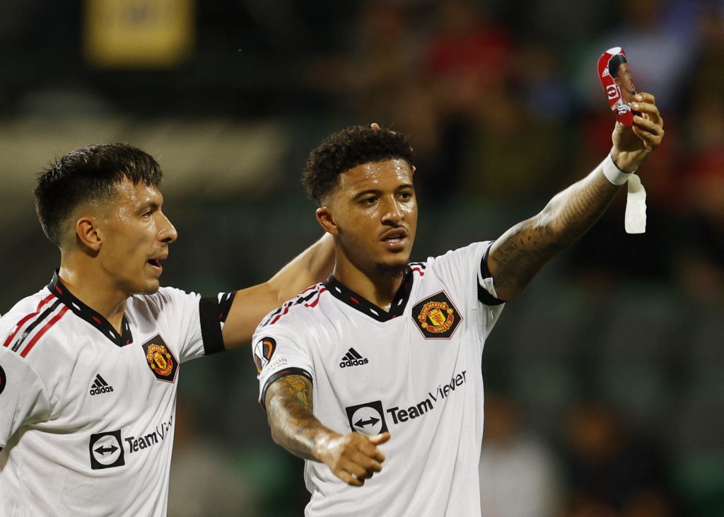 Manchester United's Jadon Sancho celebrates scoring their first goal with Lisandro Martinez.